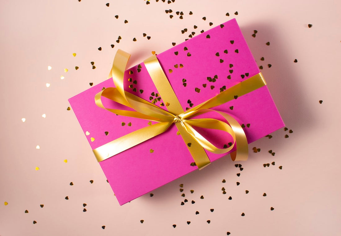 Luxury jewellery gift box open to reveal a delicate gold-tone pendant necklace — jewellery gift guide UAE 2026 by AJIVA Fashion