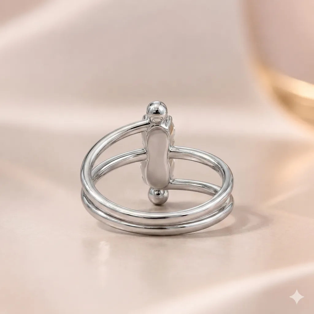 Front view of silver double-band ring showing vertical two-stone setting with ball accents