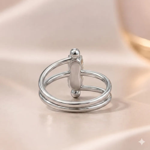 Front view of silver double-band ring showing vertical two-stone setting with ball accents