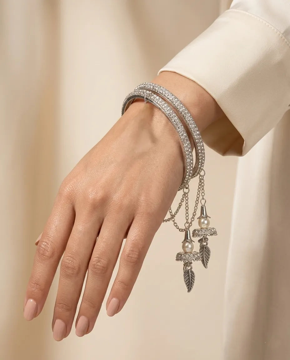 Silver CZ Pave Bangle Set with Hanging Jhumka Pearl & Feather Chain Drops | Diamond-Look Crystal Kada with Mini Bell Charms | Indian Bridal & Festive Jewelry for Women