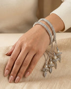 Silver CZ Pave Bangle Set with Hanging Jhumka Pearl & Feather Chain Drops | Diamond-Look Crystal Kada with Mini Bell Charms | Indian Bridal & Festive Jewelry for Women