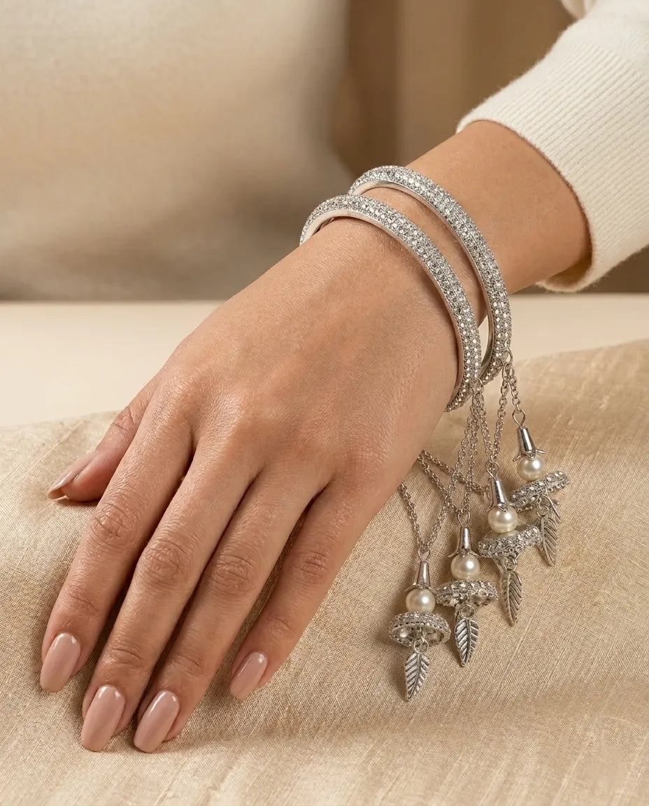 Silver CZ Pave Bangle Set with Hanging Jhumka Pearl & Feather Chain Drops | Diamond-Look Crystal Kada with Mini Bell Charms | Indian Bridal & Festive Jewelry for Women