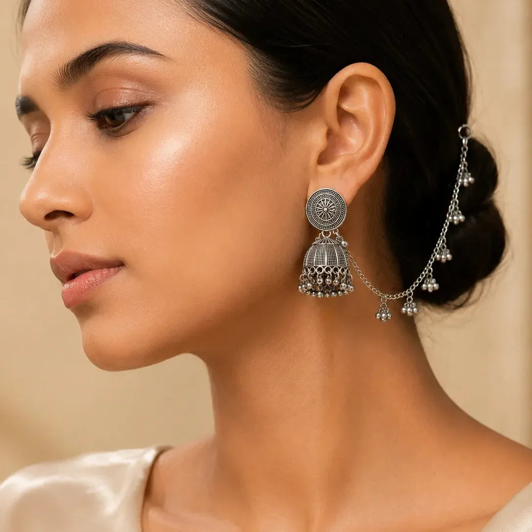 Close-up of a woman wear  earrings with Lightweight oxidized danglers for ethnic outfits