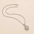 Silver heart halo CZ pendant necklace laid out showing full box chain and S-hook clasp