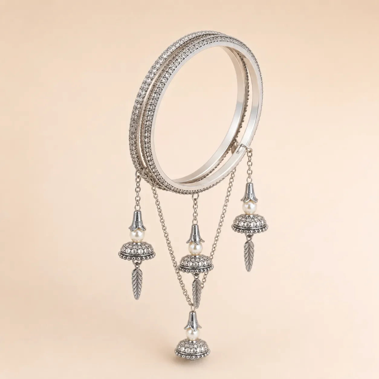 Silver CZ Pave Bangle Set with Hanging Jhumka Pearl & Feather Chain Drops | Diamond-Look Crystal Kada with Mini Bell Charms | Indian Bridal & Festive Jewelry for Women