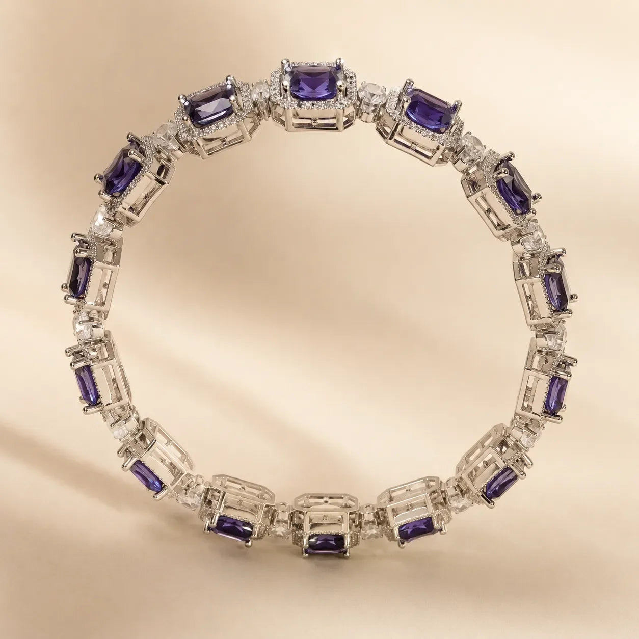 Silver royal purple square cut CZ pave octagonal halo bangle bracelet showing full 360° link design on beige background