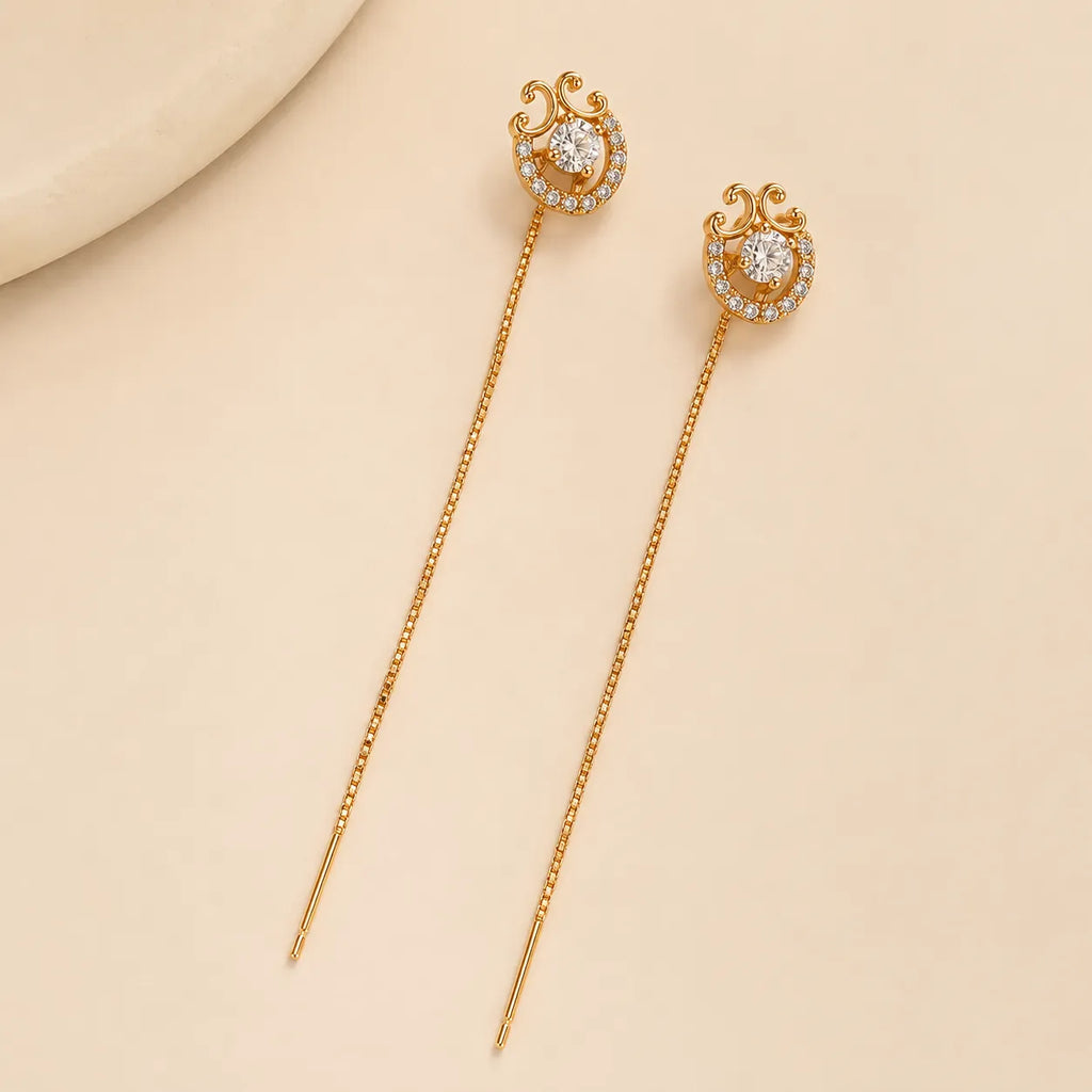 "Gold halo crystal earrings with scroll detail and chain threader"