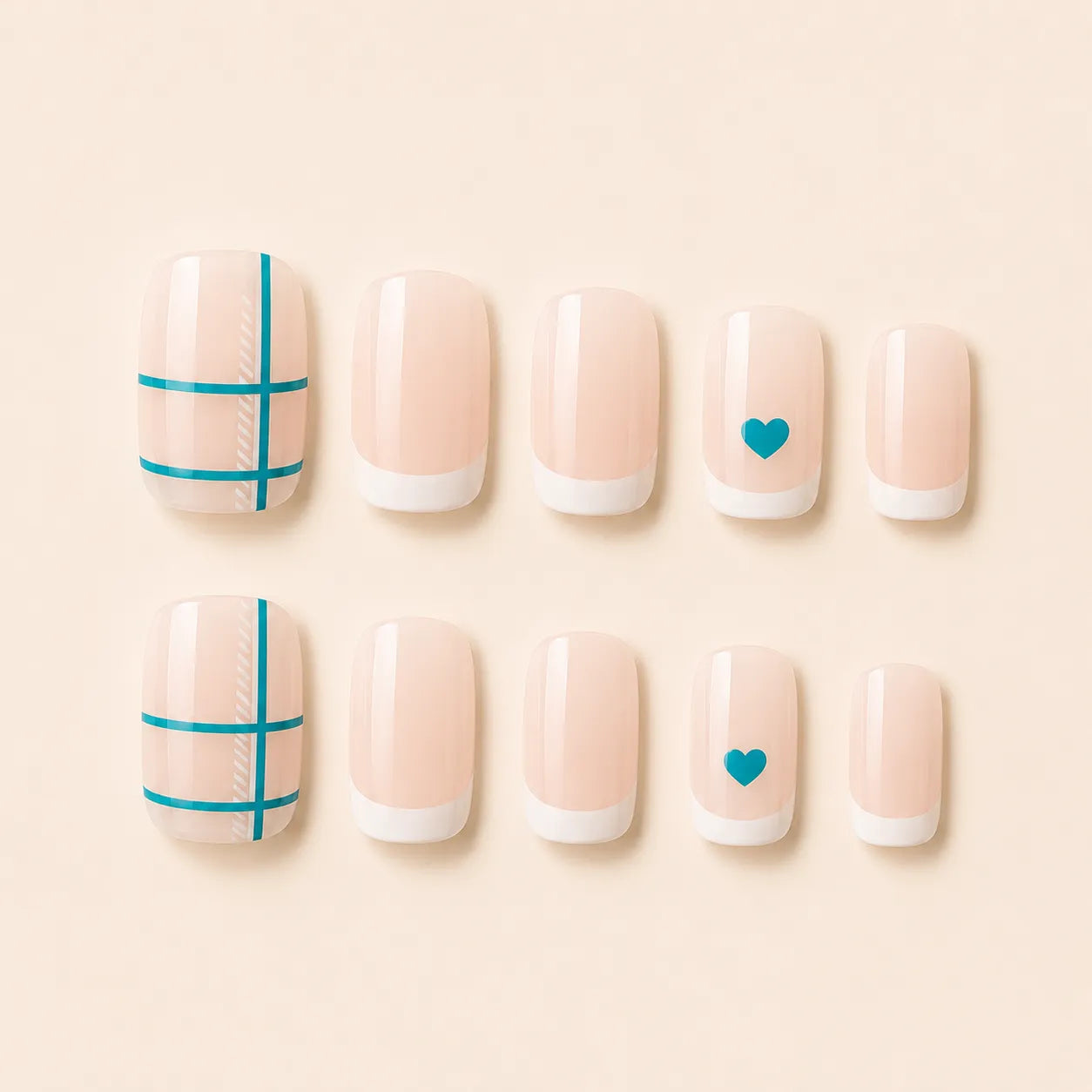 Set of 12 short square nude French tip press-on nails with teal crosshatch grid and teal heart accent nails on cream background