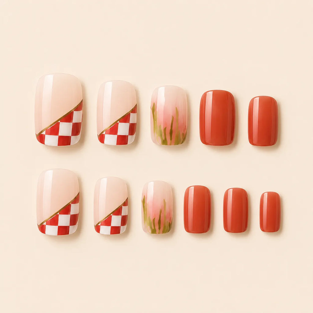 "Set of terracotta and red checkerboard press-on nails with floral accent"