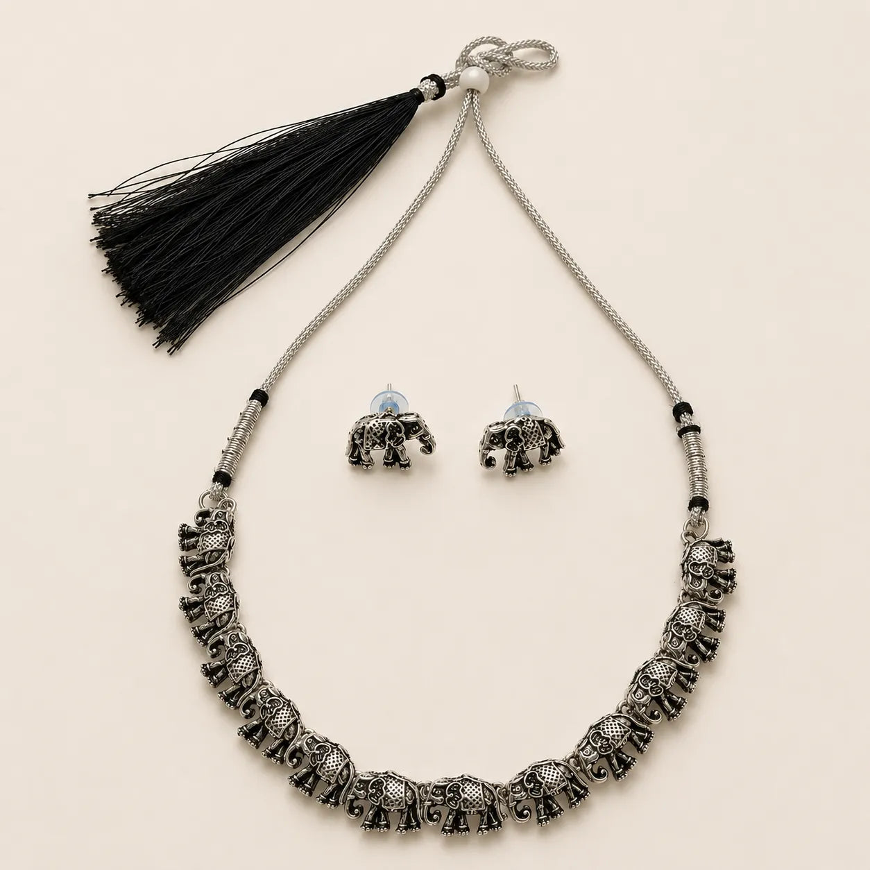 "Oxidized silver elephant choker necklace set with tassel and stud earrings"