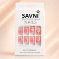  SAVNI press on nails packaging showing pink ombre nails with heart and dot design, 12 piece natural manicure set