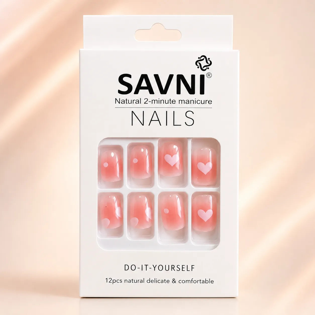  SAVNI press on nails packaging showing pink ombre nails with heart and dot design, 12 piece natural manicure set