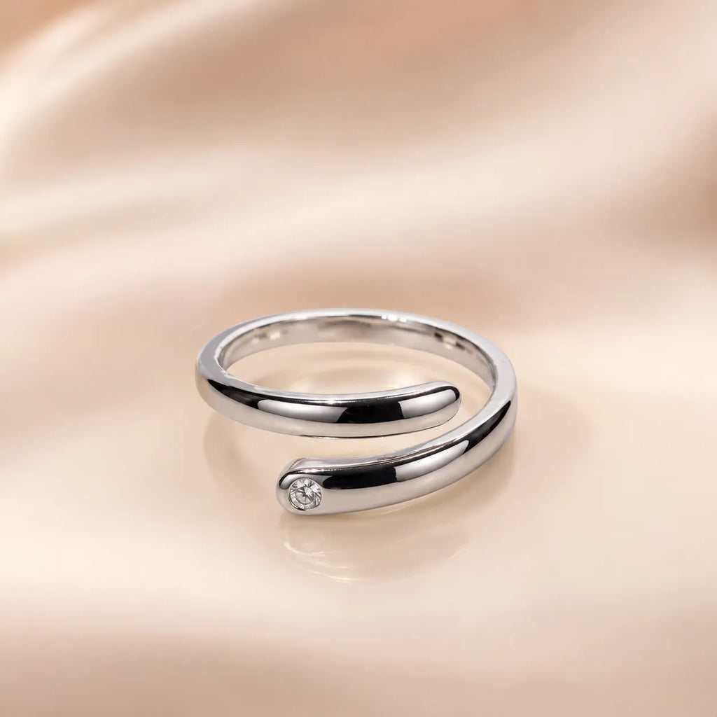 "Silver open wrap ring with round CZ stone accent detail"