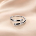  "Silver open wrap ring with round CZ stone accent detail"