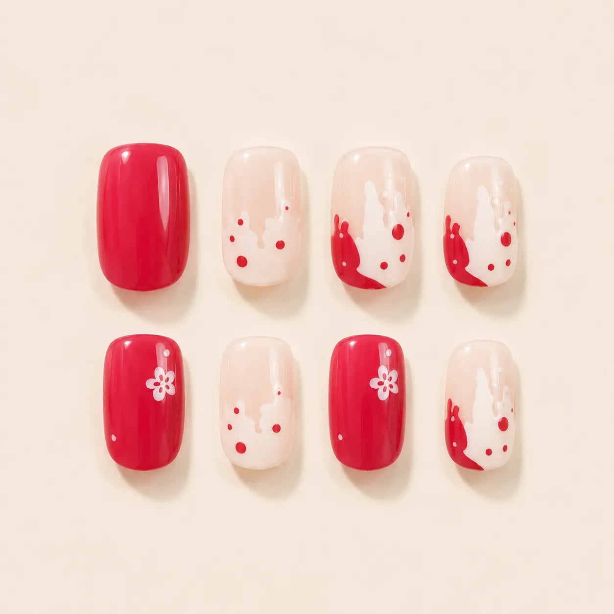 "Set of red glossy and cream watercolor press-on nails with flower accents"