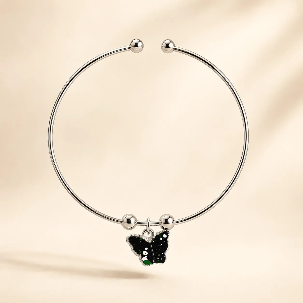 Single silver open cuff bangle with black green galaxy butterfly enamel charm and ball-bead accents