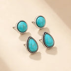 Turquoise stud earring set showing round and teardrop pairs on beige background