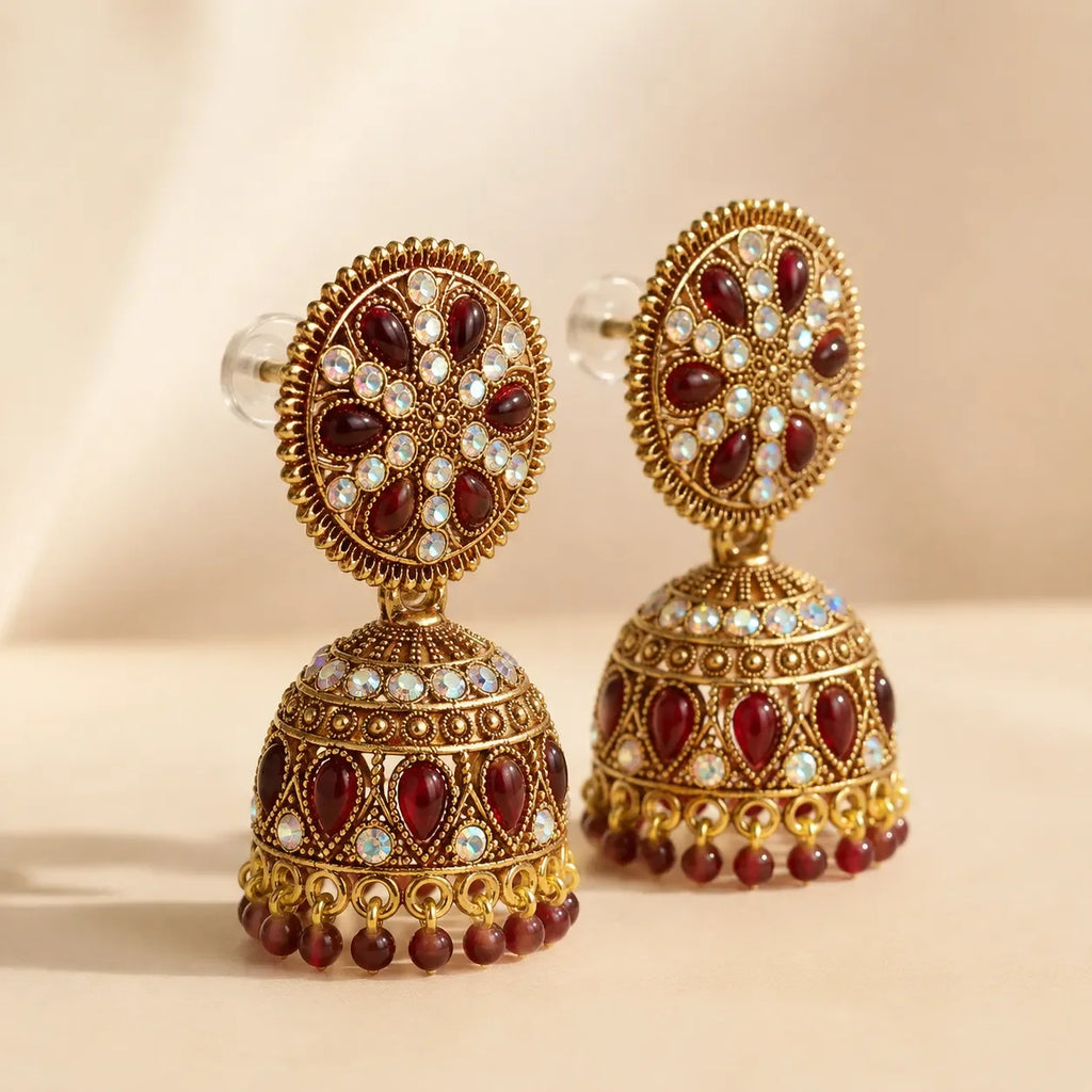 Side and rear view of antique gold maroon kundan jhumka earrings showing secure push-back stud closure and full dome structure detail