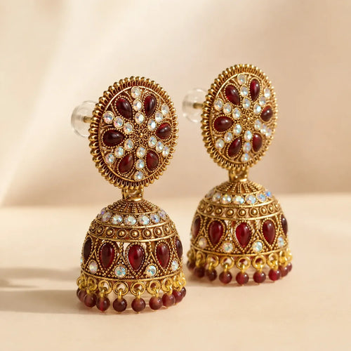 Side and rear view of antique gold maroon kundan jhumka earrings showing secure push-back stud closure and full dome structure detail