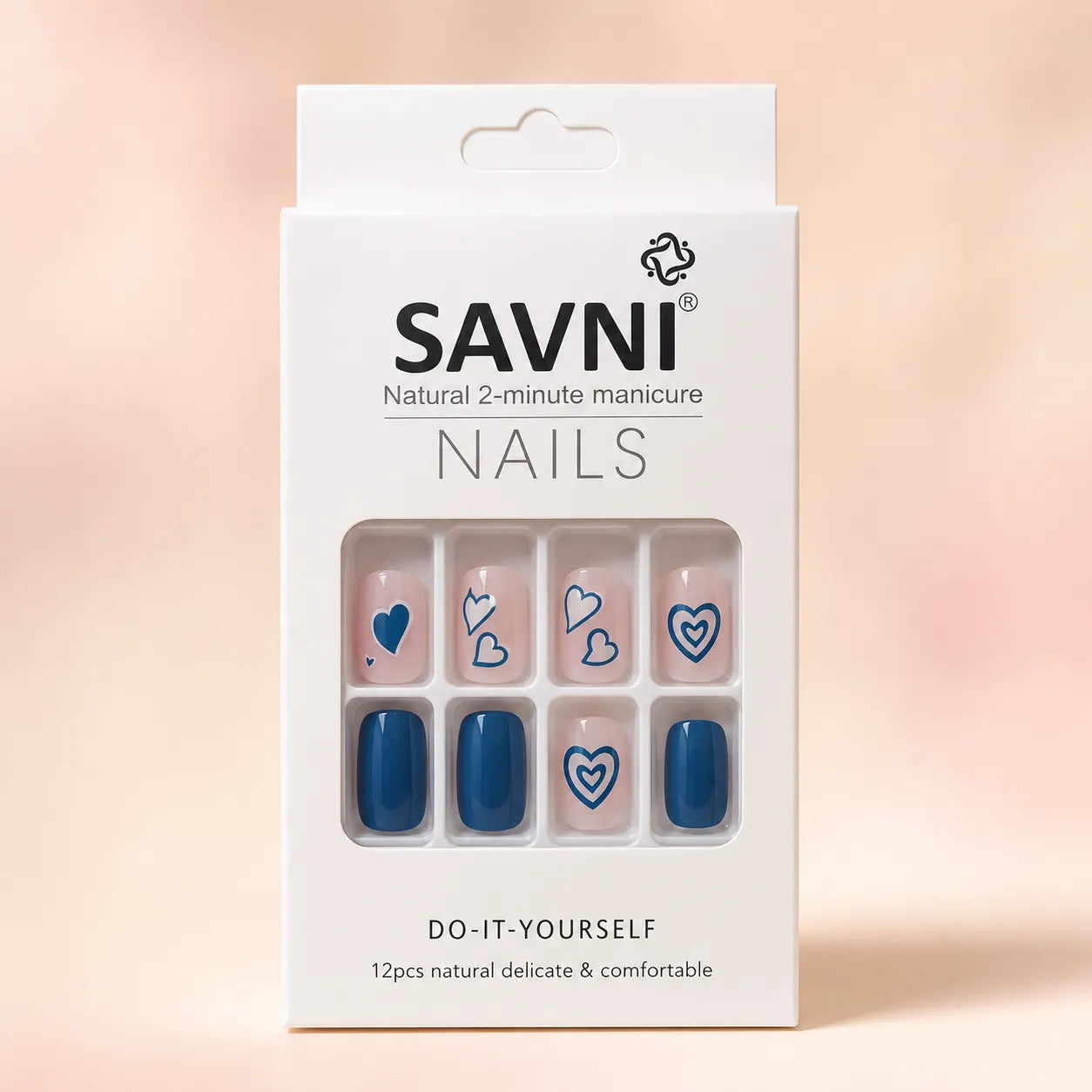 SAVNI Nails packaging box showing blue heart press-on nail design, natural 2-minute DIY manicure, 12-piece set
