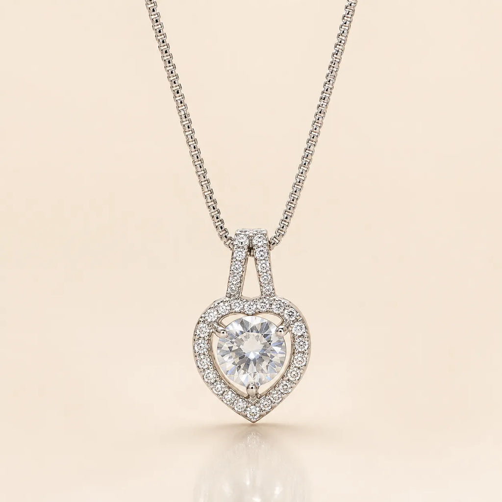 Close-up of heart halo pendant necklace showing round CZ solitaire and crystal halo detail