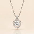 Close-up of heart halo pendant necklace showing round CZ solitaire and crystal halo detail