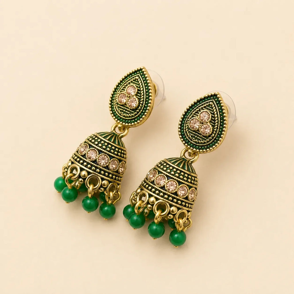 Antique gold green meenakari teardrop jhumka earrings angled showing enamel dome detail and emerald green bead drop fringe