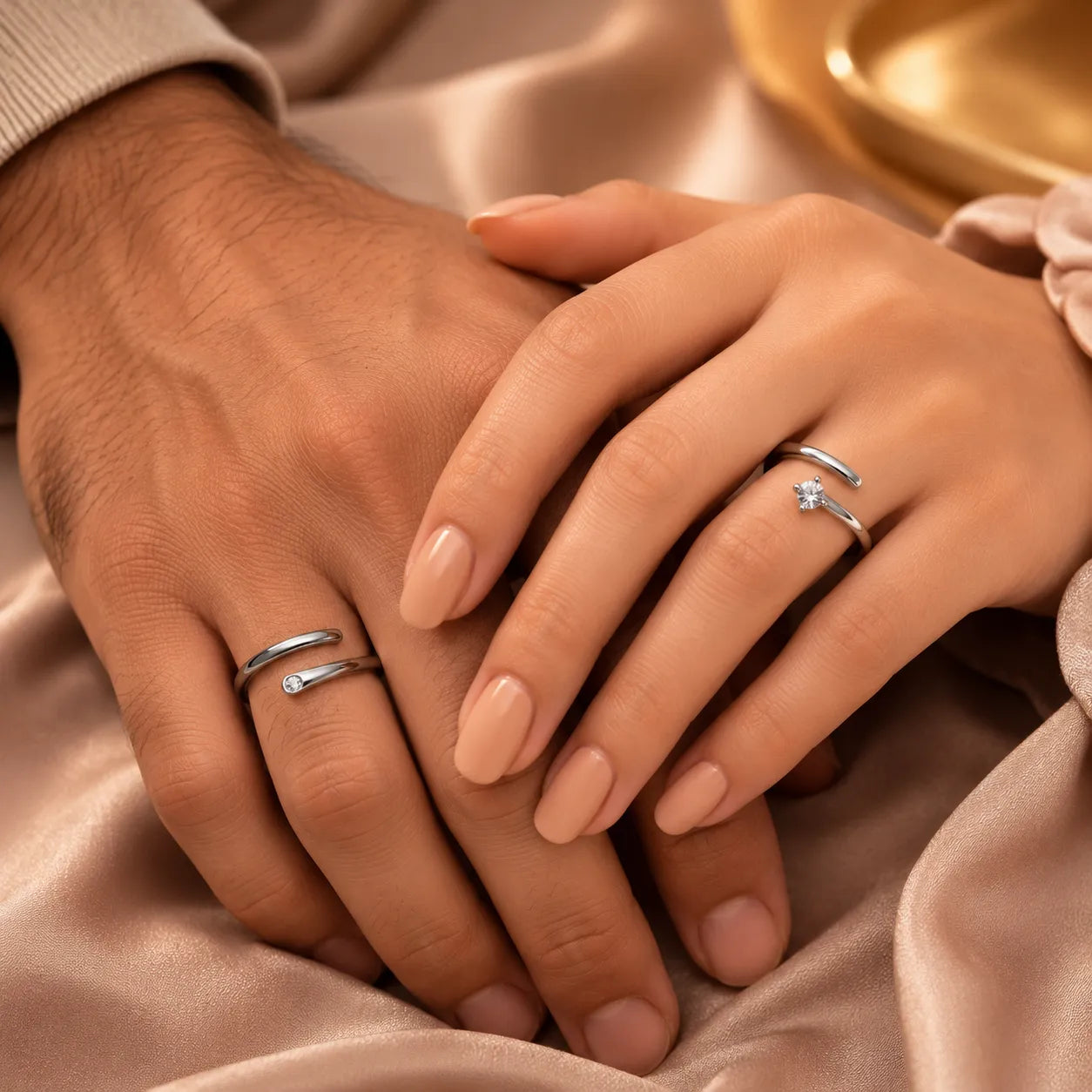 "Couple wearing matching silver wrap rings with CZ accent stone"