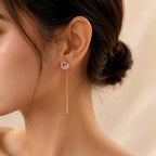 "Woman wearing rose gold CZ threader earring with chain drop"