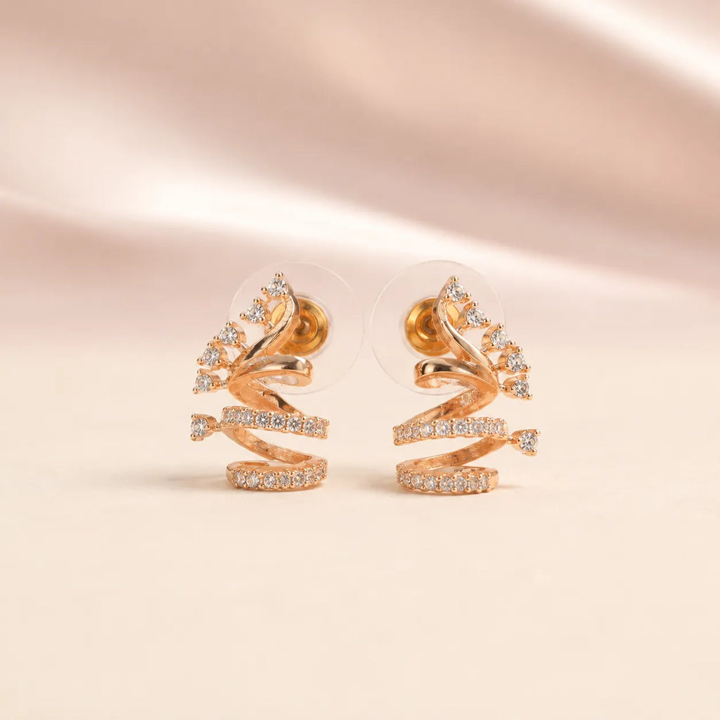 Back view of rose gold sculptural spiral coil CZ crystal stud earrings showing secure gold pin stud and silicone comfort disc backing
