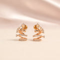 Back view of rose gold sculptural spiral coil CZ crystal stud earrings showing secure gold pin stud and silicone comfort disc backing