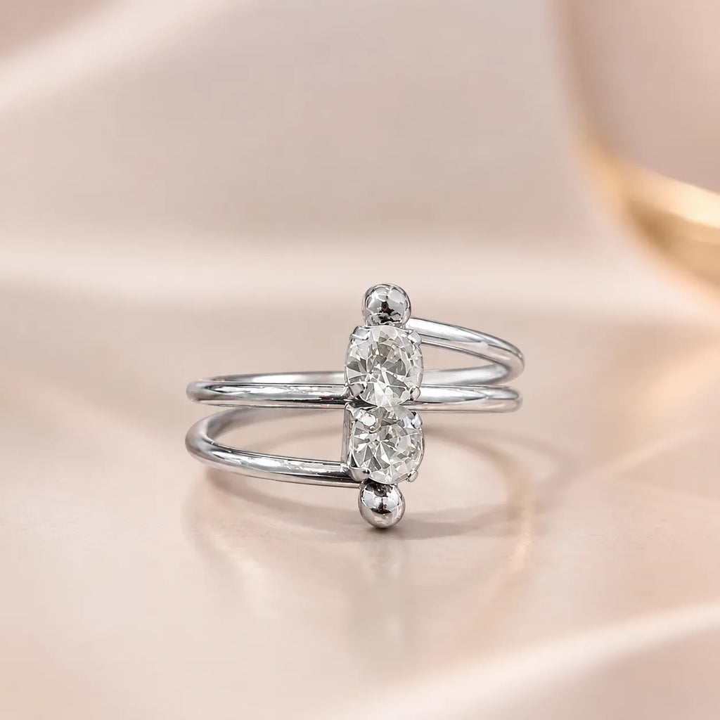  Close-up of silver two stone ring showing crossover double band and vertical CZ stones