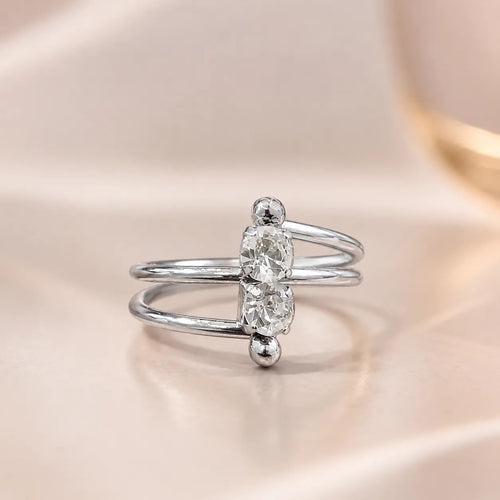  Close-up of silver two stone ring showing crossover double band and vertical CZ stones
