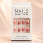 White retail box packaging of pink ombre French tip press-on nails set showing 24pcs natural delicate DIY nail kit