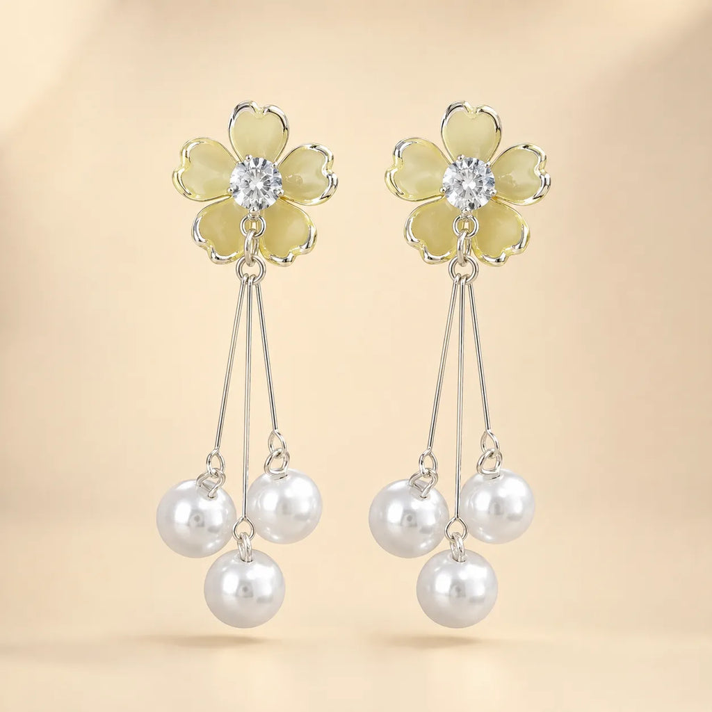  "Pair of yellow flower earrings with CZ center and dangling pearl tassels"