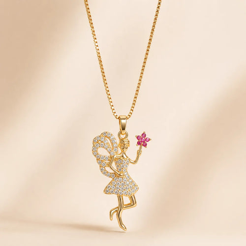 Gold fairy pendant necklace with pink crystal flower, full chain flat lay with lobster clasp on cream background