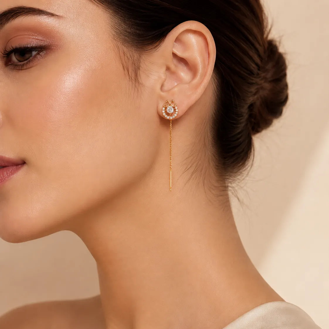 "Woman wearing gold vintage halo threader earring with chain drop"