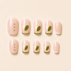 "Set of nude press-on nails with olive green heart and French tip design"