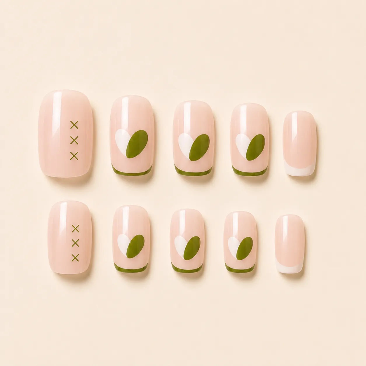 "Set of nude press-on nails with olive green heart and French tip design"