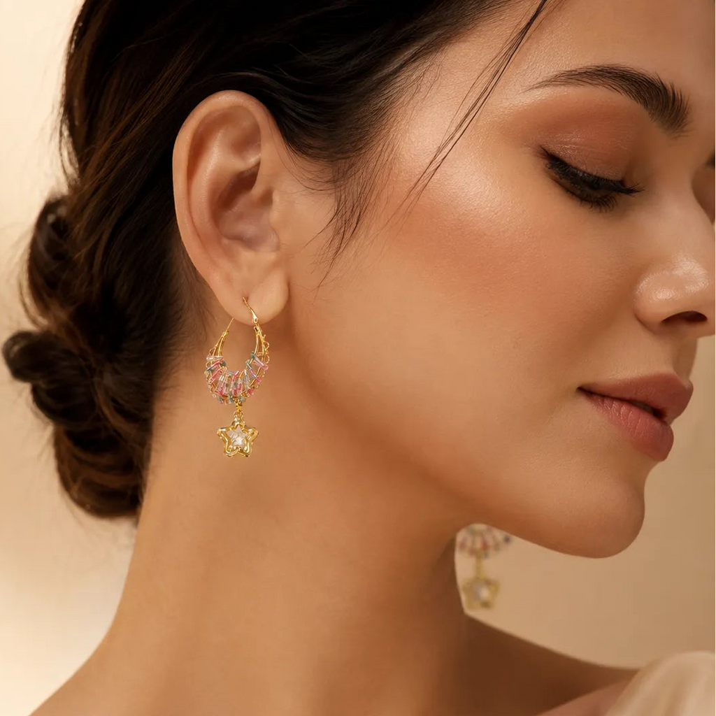 Close-up of a woman wearing elegant earrings with a soft background