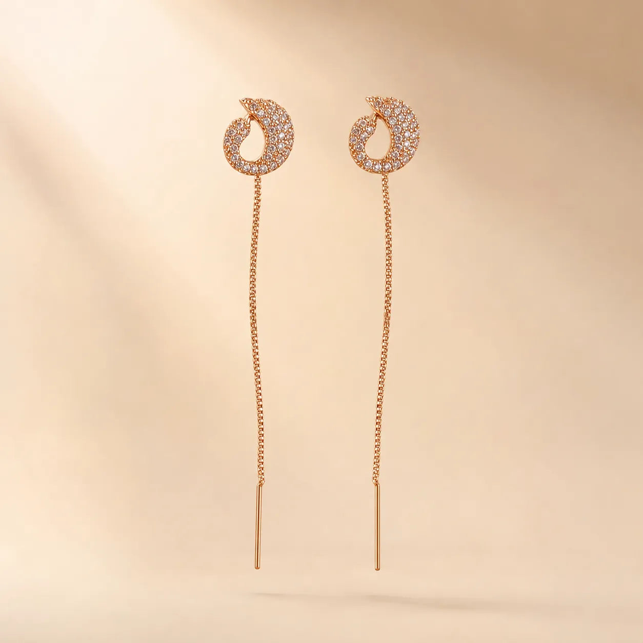 "Pair of rose gold CZ threader earrings with long chain drop"