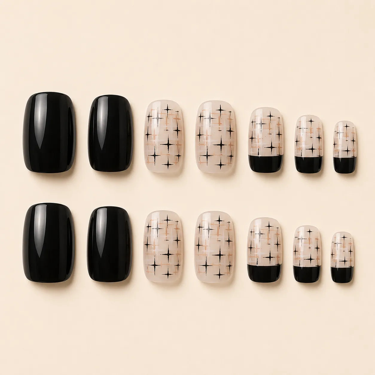 Set of black glossy and nude starburst print press-on nails in assorted sizes