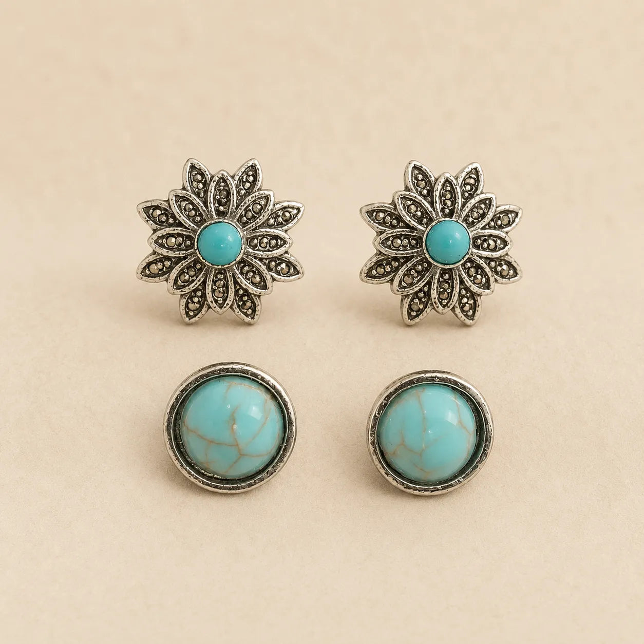  "Set of two turquoise stud earrings, silver flower design and round bezel design"