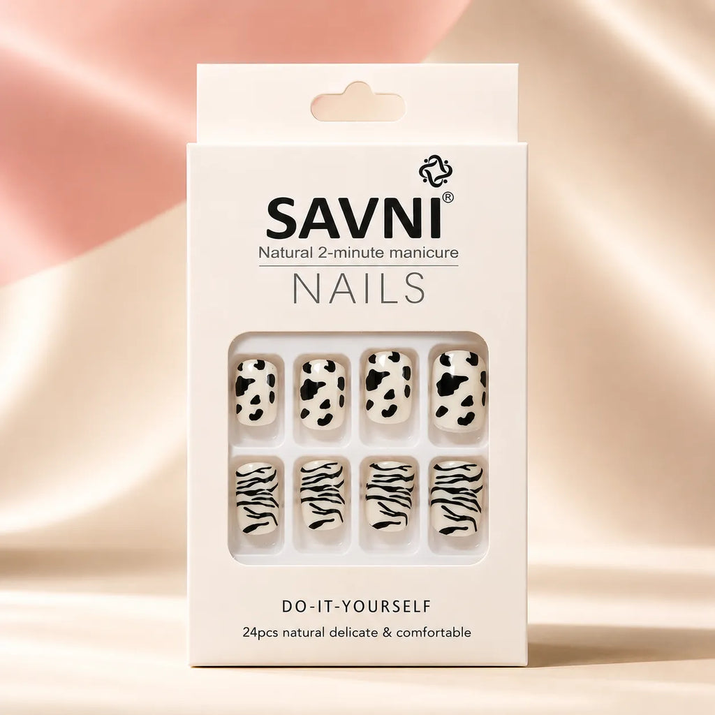 SAVNI Nails packaging box showing cow print and zebra print press-on nail design, natural 2-minute DIY manicure, 24-piece set