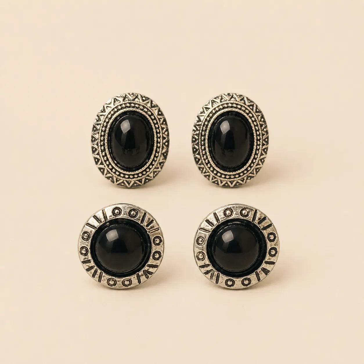 "Set of black stone stud earrings, oval aztec design and round beaded design"