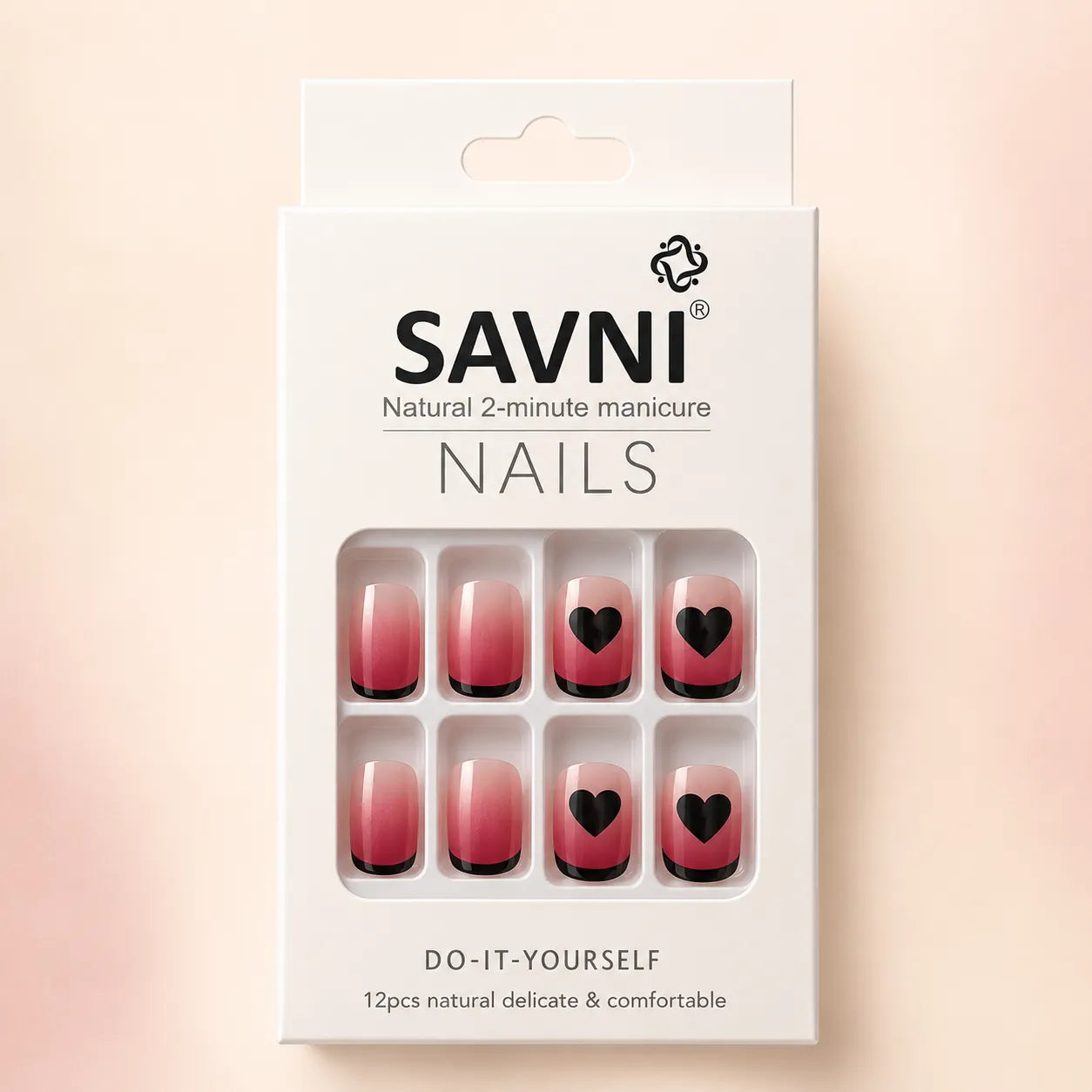 SAVNI Nails packaging box showing pink ombre press-on nails with black heart French tips, natural 2-minute DIY manicure, 12-piece set