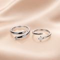 "Set of two matching silver wrap rings, one plain and one with CZ stone"