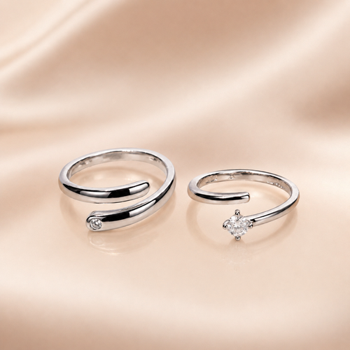 "Set of two matching silver wrap rings, one plain and one with CZ stone"